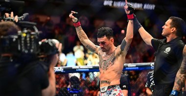 Max Holloway celebrates after winning the lightweight title fight at UFC 318, New Orleans, U.S., July 19, 2025. (AP Photo)
