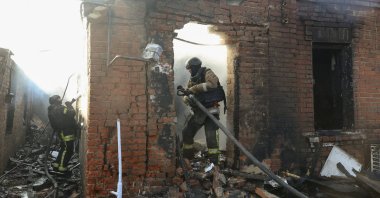 Ukrainian rescuers work at the site of a Russian strike on a private building in Kharkiv, northeastern Ukraine, May 6, 2026. (EPA Photo)