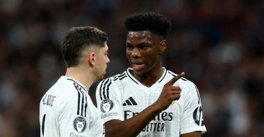 Real Madrid's Federico Valverde (L) and Aurelien Tchouameni chat during the second leg of the Champions League knockout phase playoff between Real Madrid and Manchester City at Santiago Bernabeu, Madrid, Spain, Feb. 19, 2025. (Reuters Photo)