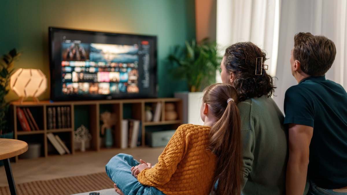 A family watches a television drama together at home as Turkish TV series continue to expand their global cultural influence. (Shutterstock Photo) 