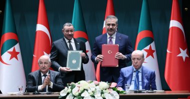 President Recep Tayyip Erdoğan and Algerian President Abdelmadjid Tebboune preside over a signing ceremony as Foreign Minister Hakan Fidan signs an agreement, Ankara, Türkiye, May 7, 2026. (AA Photo)