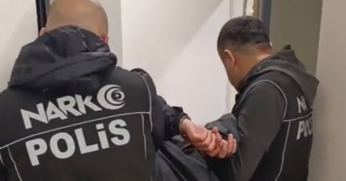 A foreign drug trafficker wanted under an Interpol Red Notice is detained during a police operation, Mersin, Türkiye, May 7, 2026. (AA Photo)