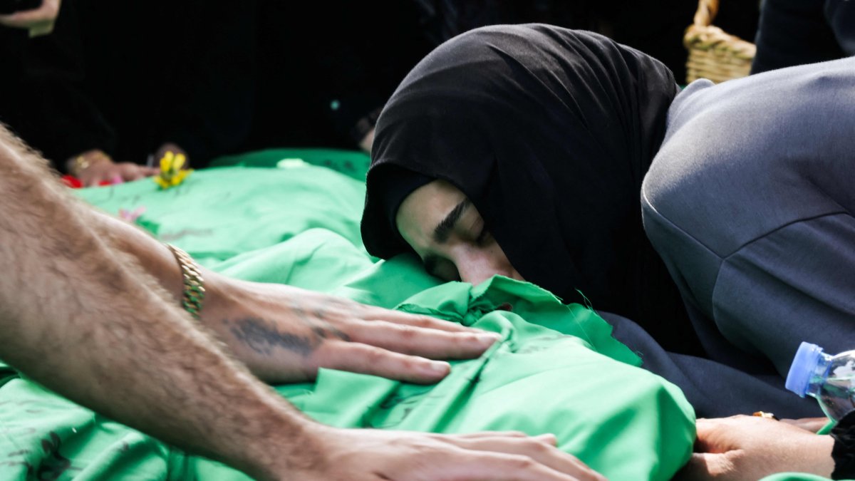 A women grieves as she rests her head on one of nine people killed the day before in an Israeli airstrike on the southern Lebanese village of Jibshit, Sidon, southern Lebanon, May 10, 2026. (AFP Photo)