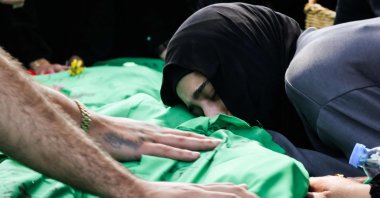 A women grieves as she rests her head on one of nine people killed the day before in an Israeli airstrike on the southern Lebanese village of Jibshit, Sidon, southern Lebanon, May 10, 2026. (AFP Photo)