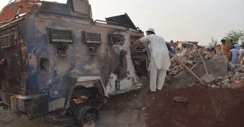 People survey the scene of an overnight car bomb attack at a police post in Bannu, Khyber Pakhtunkhwa province, Pakistan, May 10, 2026. (EPA Photo)