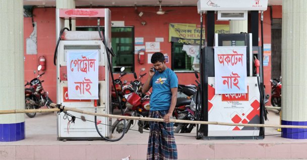 Mohammad Yusuf, a farmer, speaks on his phone as he arrives at a fuel station to buy diesel to irrigate his paddy field, but finds none available amid a fuel crisis, in Manikganj, Bangladesh, April 8, 2026. (Reuters Photo)