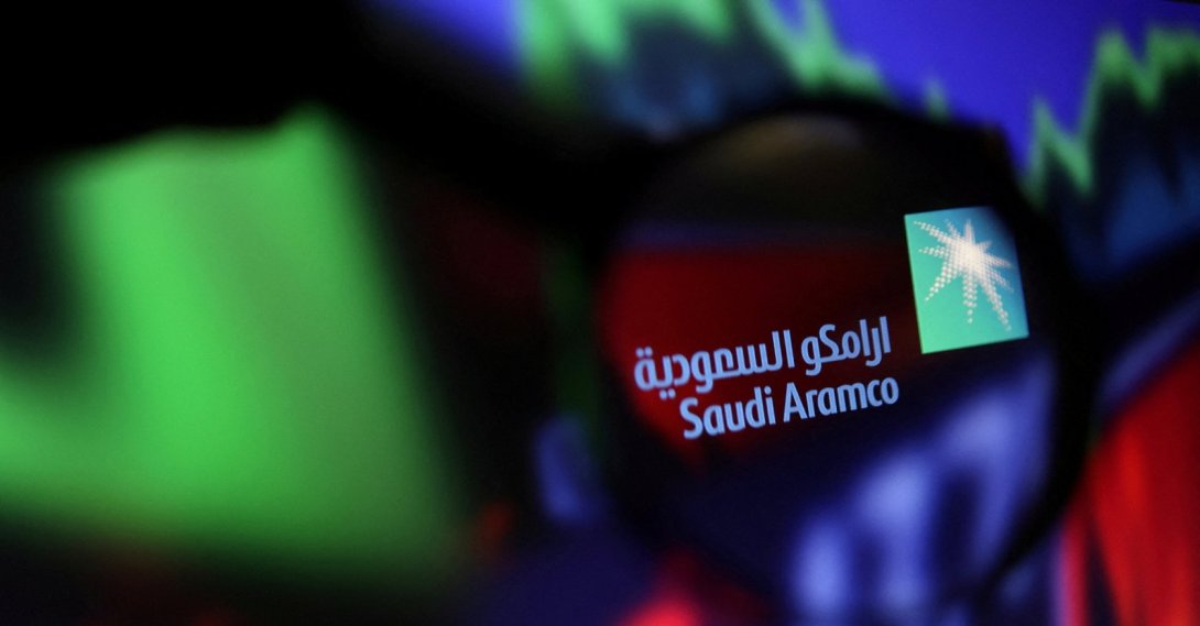 Saudi Aramco logo and stock graph are seen through a magnifier displayed in this illustration taken Sept. 4, 2022. (Reuters Photo)
