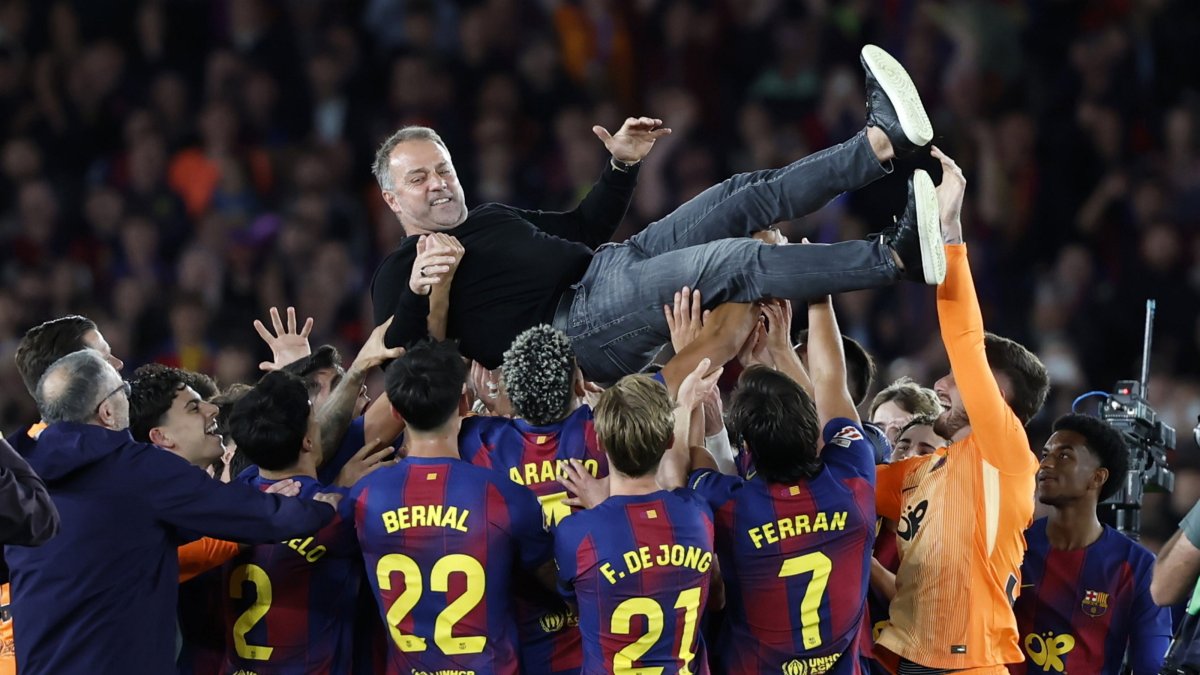 Barcelona's players and their head coach Hansi Flick (C) celebrate the 2025/2026 Spanish La Liga Championship after winning the 2025-2026 Spanish League after the Spanish league football match against Real Madrid at Camp Nou Stadium, Barcelona, Spain, May 10, 2026. (EPA Photo)