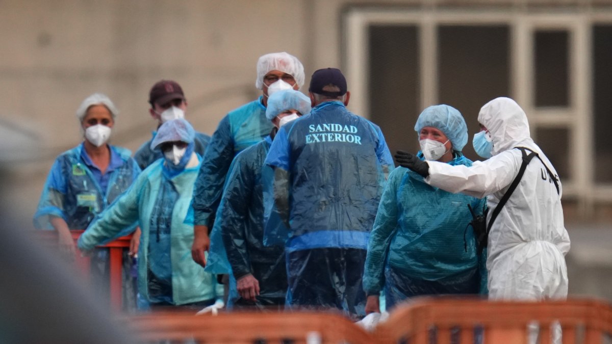 Passengers are disembarked from the hantavirus-stricken cruise ship MV Hondius at the port of Granadilla in Tenerife, Canary Islands, Spain, May 10, 2026. (AP Photo)