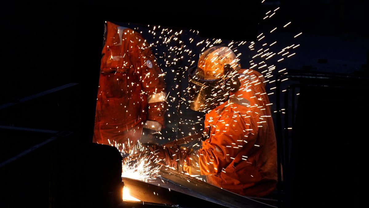 Workers in the rail and sections hot end rolling mill at the British Steel site in Scunthorpe, Lincolnshire, U.K., April 17, 2025. (AFP Photo)
