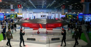 Visitors view a Bayraktar Kızılelma unmanned combat aircraft (UCAV), developed by the Turkish defense company Baykar, on display during the opening day of SAHA 2026 expo, an international defense and aerospace exhibition held in Istanbul, Türkiye, May 5, 2026. (AFP Photo)