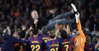Barcelona's players and their head coach Hansi Flick (C) celebrate the 2025/2026 Spanish La Liga Championship after winning the 2025-2026 Spanish League after the Spanish league football match against Real Madrid at Camp Nou Stadium, Barcelona, Spain, May 10, 2026. (EPA Photo)