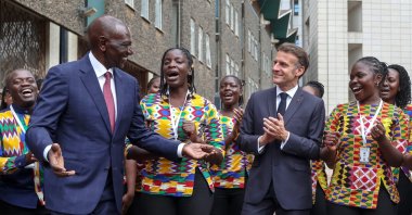 France's President Emmanuel Macron (3rd R) and Kenya's President William Ruto (2nd L) sings and dances with choir members upon their arrival ahead of the Africa Forward summit, Nairobi, Kenya, May 11, 2026. (AFP Photo)