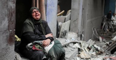 A woman cries at the site of a Friday Israeli air strike on houses at Shati (Beach) refugee camp, Gaza City, Palestine, May 9, 2026. (Reuters Photo)