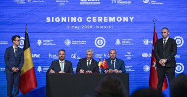 Trade Minister Ömer Bolat (C), Belgian Foreign Minister Maxime Prevot and Defense Minister Theo Francken sign a joint declaration aimed at strengthening bilateral trade relations, Istanbul, Türkiye, May 11, 2026. (AA Photo)