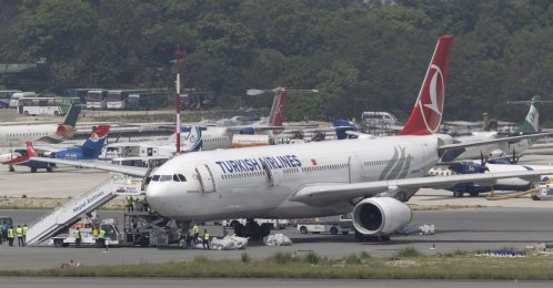 Ground staff collect an emergency ladder from a Turkish Airlines aircraft at Tribhuvan International Airport in Kathmandu, Nepal, May 11, 2026. (EPA Photo)