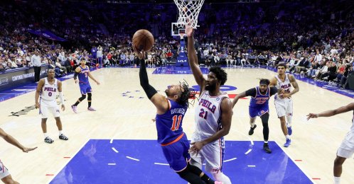 New York Knicks' Jalen Brunson (L) shoots against Philadelphia 76ers' Joel Embiid during the second half in Game Four of the Second Round of the NBA Eastern Conference Playoffs at Xfinity Mobile Arena, Philadelphia, U.S., May 10, 2026. (AFP Photo)