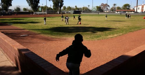 Students play ball during recess at the St. Agnes Elementary School in Phoenix, U.S., March 3, 2020. (AP Photo)