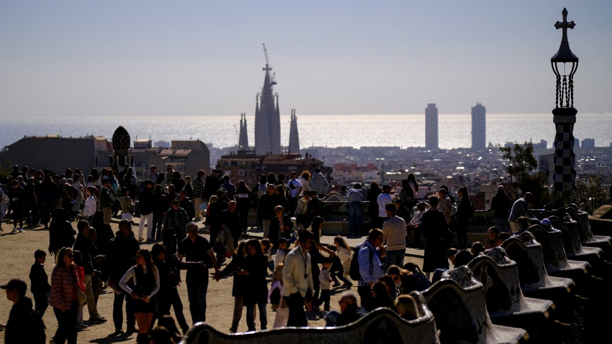 Tourists enjoy the Park Guell, designed by Catalan architect Antoni Gaudi, during the Holy Week in Barcelona, Spain, April 1, 2026. (Reuters Photo)