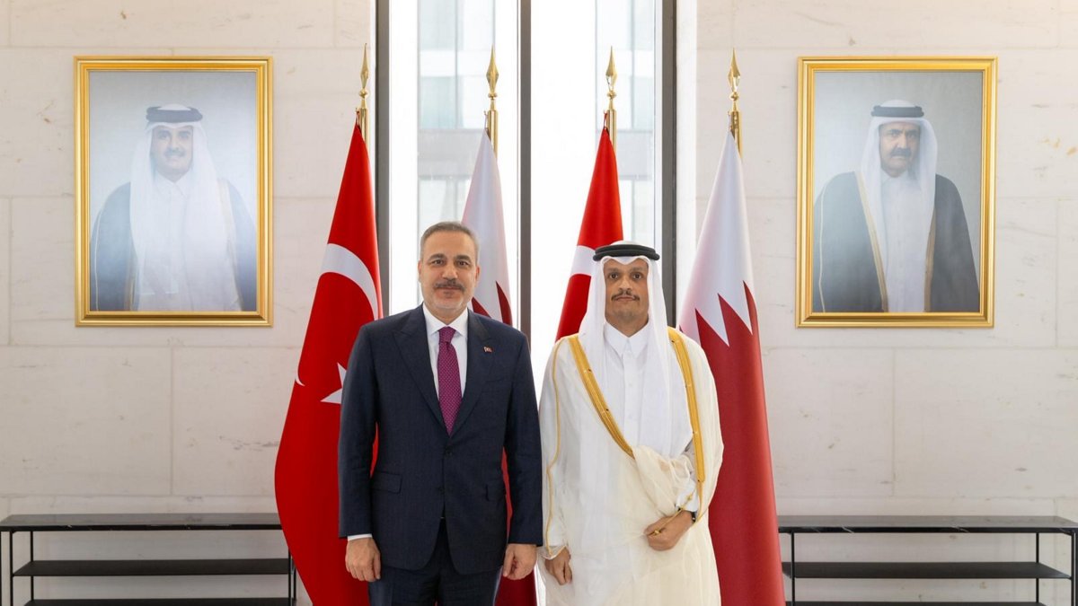 Turkish FM Hakan Fidan (L) poses with Qatari counterpart Mohammed bin Abdulrahman bin Jassim bin Jaber Al Thani during their meeting, in Doha, Qatar, May 12, 2026. (AA Photo) 