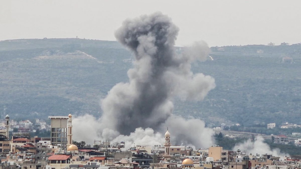 A photograph taken from the southern area of Tyre shows smoke rising from the site of an Israeli airstrike that targeted the area of Ras Al-Ain, Lebanon, May 12, 2026. (AFP Photo)