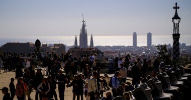 Tourists enjoy the Park Guell, designed by Catalan architect Antoni Gaudi, during the Holy Week in Barcelona, Spain, April 1, 2026. (Reuters Photo)