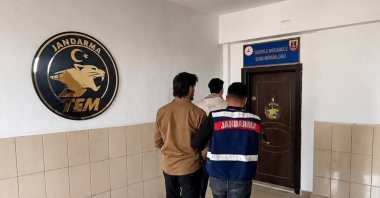Gendarmerie officers escort a captured Daesh suspect, Mersin, southern Türkiye, May 8, 2026. (AA Photo)