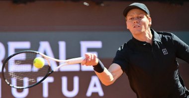 Italy's Jannik Sinner hits a return to Australia's Alexei Popyrin during the ATP Rome Open tennis tournament at Foro Italico, Rome, Italy, May 11, 2026. (AFP Photo)