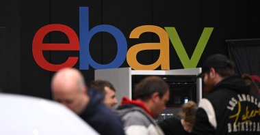 The logo of e-commerce company eBay is pictured at an exhibition booth for vehicle parts at the Essen Motor Show in Essen, Germany, Dec. 4, 2024. (AFP Photo)