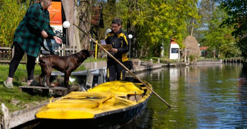 Mailperson Andrea Bunar delivers mail from a boat during the first tour of the summer in the village of Lehde, Luebbenau, Germany, April 29, 2026. (AP Photo)