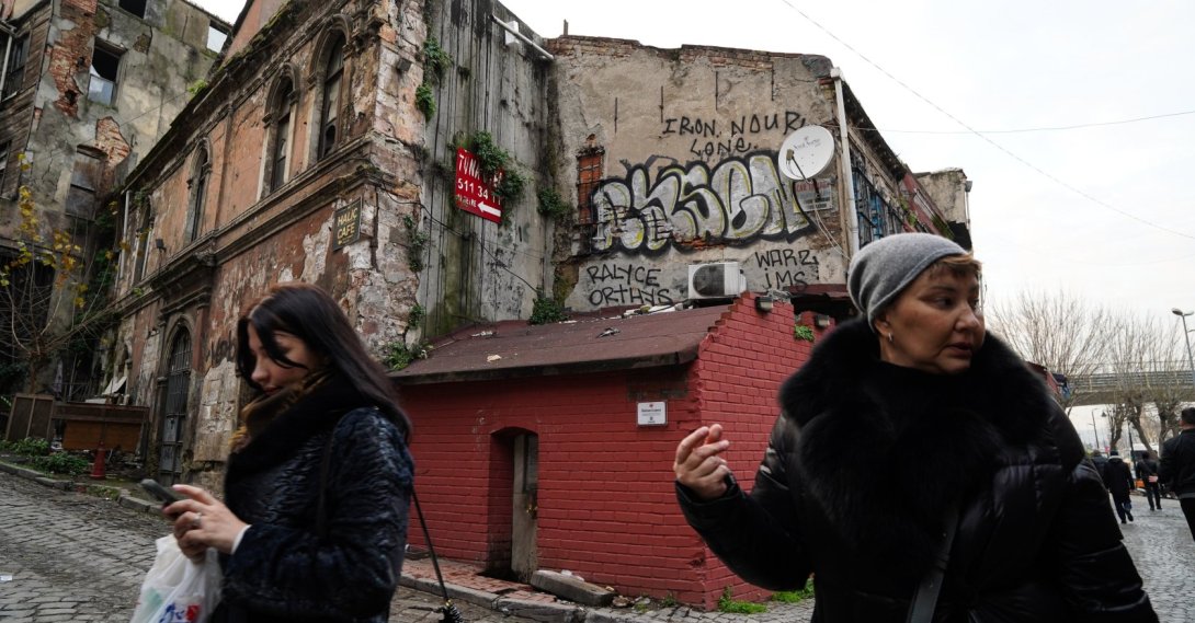 Two women walk past a historic alley in Istanbul, Türkiye, Jan. 14, 2026. (Getty Images Photo)