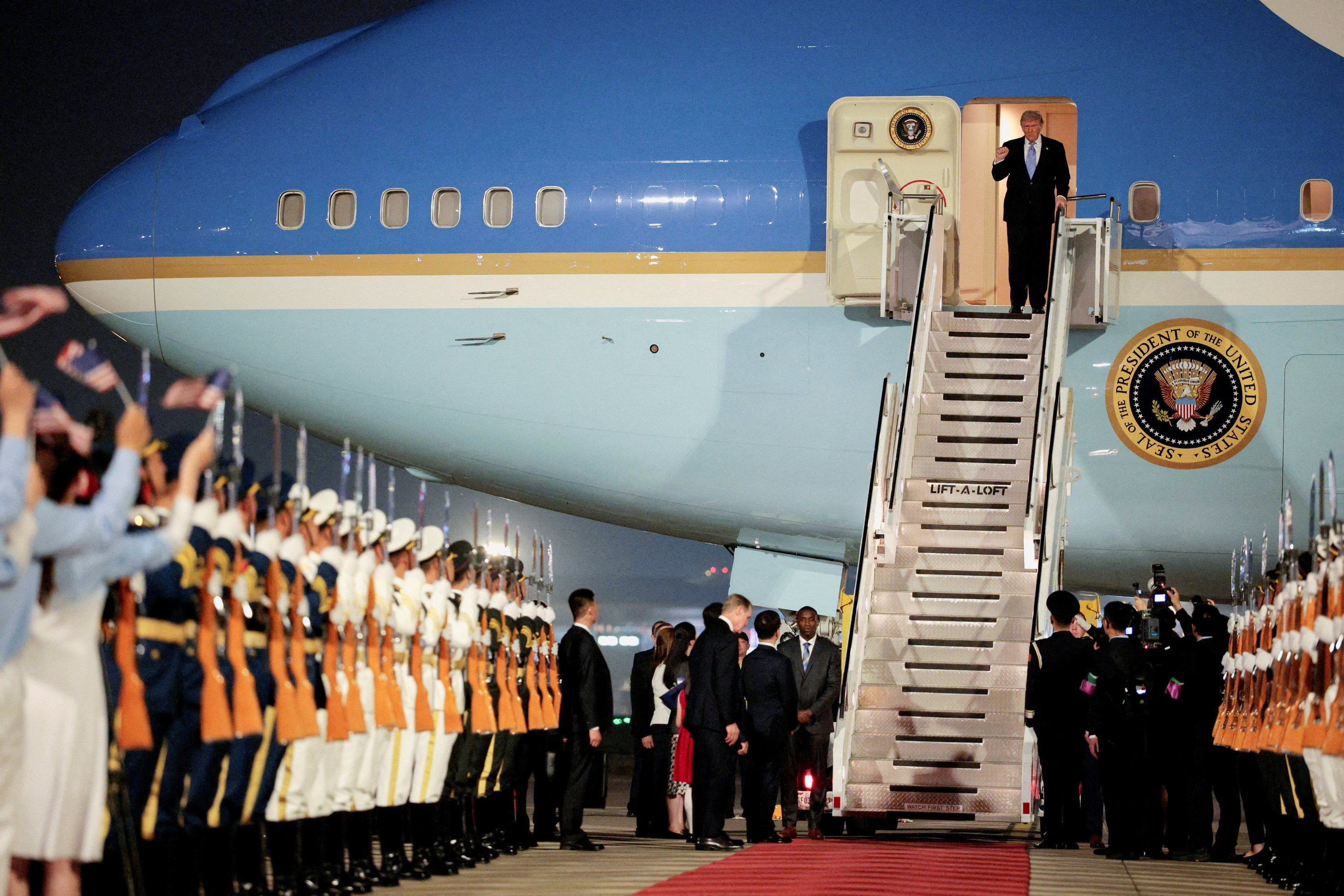 Trump lands in Beijing for key summit with Xi amid Iran, trade wars
