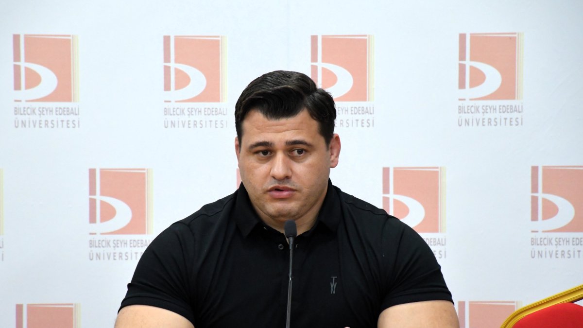 European wrestling champion Rıza Kayaalp speaks during a talk titled “Listen to the Path to Success from a Champion” organized by Bilecik Şeyh Edebali University Student Clubs Coordination Office at the Faculty of Economics and Administrative Sciences conference hall, Bilecik, Türkiye, May 12, 2026. (AA Photo)

