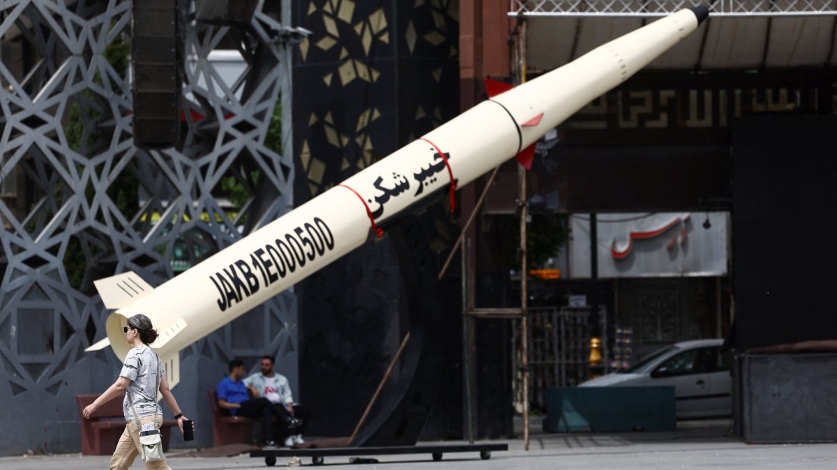 A woman walks next to a symbolic mock-up of an Iranian missile, amid a cease-fire between U.S. and Iran, in Tehran, Iran, April 27, 2026. (Reuters Photo)