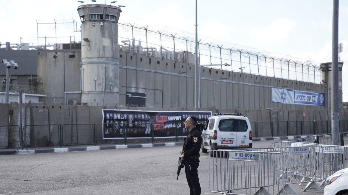 An Israeli police officer stands outside Ofer military prison near Jerusalem, Oct. 13, 2025. (AP Photo)