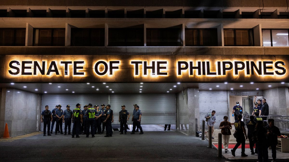 Police officers stand outside the Senate building, after gunshots were heard at the Philippine Senate, as chaos mounted in anticipation of an attempt to arrest a top senator wanted by the International Criminal Court, in Pasay City, Metro Manila, Philippines, May 13, 2026. (Reuters Photo)