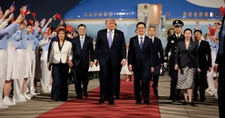 U.S. President Donald Trump walks with Chinese Vice President Han Zheng during an arrival ceremony at Beijing Capital International Airport, Beijing, China, May 13, 2026. (Reuters Photo)
