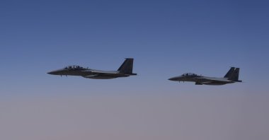 Two Royal Saudi Air Force F-15s are seen over Saudi airspace, May 13, 2025. (AP Photo)