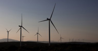 View of windmills at a wind farm in the Seferihisar district, Izmir, Türkiye. (Shutterstock Photo)