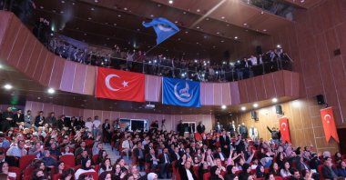 Members of the Idealists’ Club Foundation of Education and Culture wave flags during an event, Kayseri, central Türkiye, May 11, 2026. (İHA Photo)