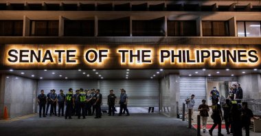 Police officers stand outside the Senate building, after gunshots were heard at the Philippine Senate, as chaos mounted in anticipation of an attempt to arrest a top senator wanted by the International Criminal Court, in Pasay City, Metro Manila, Philippines, May 13, 2026. (Reuters Photo)