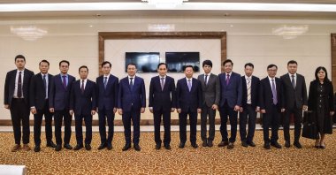 Vietnam&amp;#039;s Foreign Minister Le Hoai Trung poses for a group photo with his delegation upon arrival at the Pyongyang International Airport in Pyongyang, May 12, 2026. (AFP Photo)