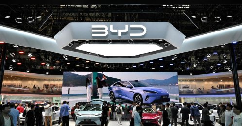People visit the BYD booth at the Beijing Auto Show in Beijing, China, April 30, 2026. (AFP Photo)