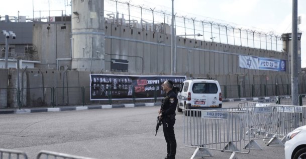 An Israeli police officer stands outside Ofer military prison near Jerusalem, Oct. 13, 2025. (AP Photo)