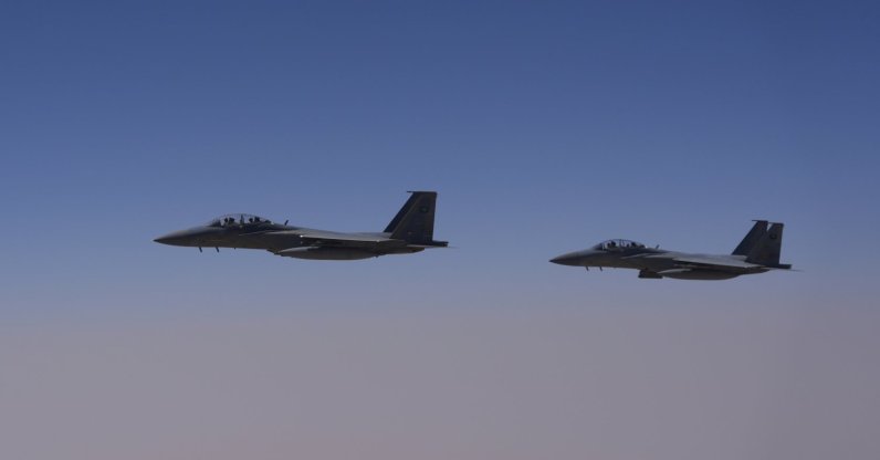 Two Royal Saudi Air Force F-15s are seen over Saudi airspace, May 13, 2025. (AP Photo)