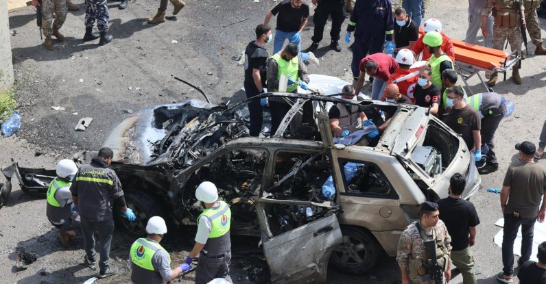 Lebanese rescuers and soldiers inspect the wreckage of a vehicle that was hit in an Israeli strike in Jiyeh town, south of Beirut, Lebanon, May 13, 2026. (EPA Photo)