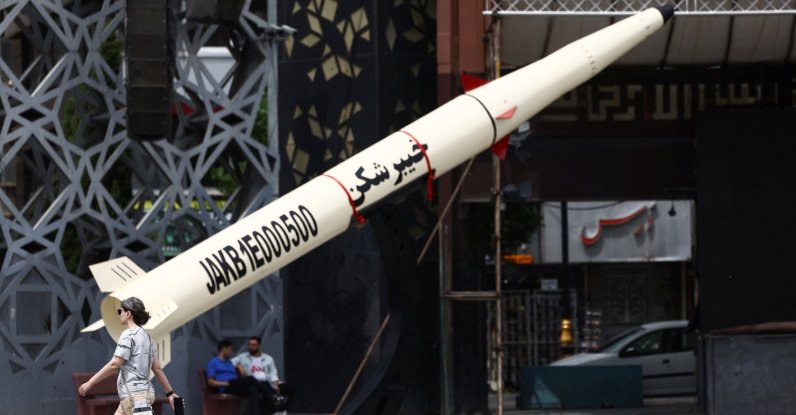 A woman walks next to a symbolic mock-up of an Iranian missile, amid a cease-fire between U.S. and Iran, in Tehran, Iran, April 27, 2026. (Reuters Photo)