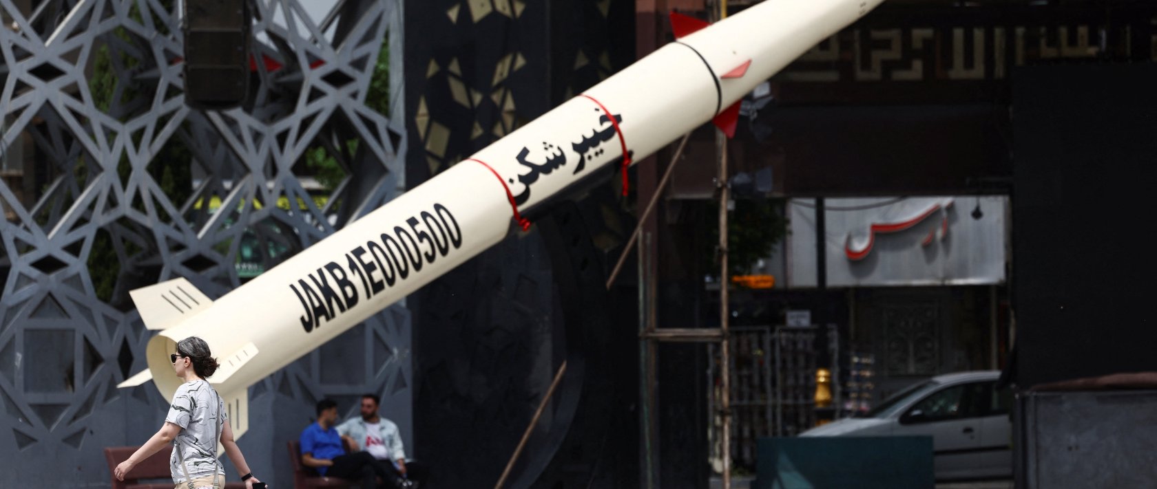 A woman walks next to a symbolic mock-up of an Iranian missile, amid a cease-fire between U.S. and Iran, in Tehran, Iran, April 27, 2026. (Reuters Photo)