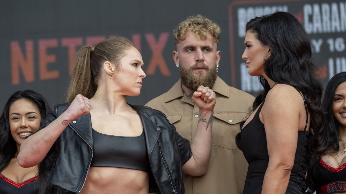 (L-R) Ronda Rousey, Jake Paul and Gina Carano as the fighters face off during a press conference at the Intuit Dome, Inglewood, U.S., March 10, 2026. (Getty Images Photo)