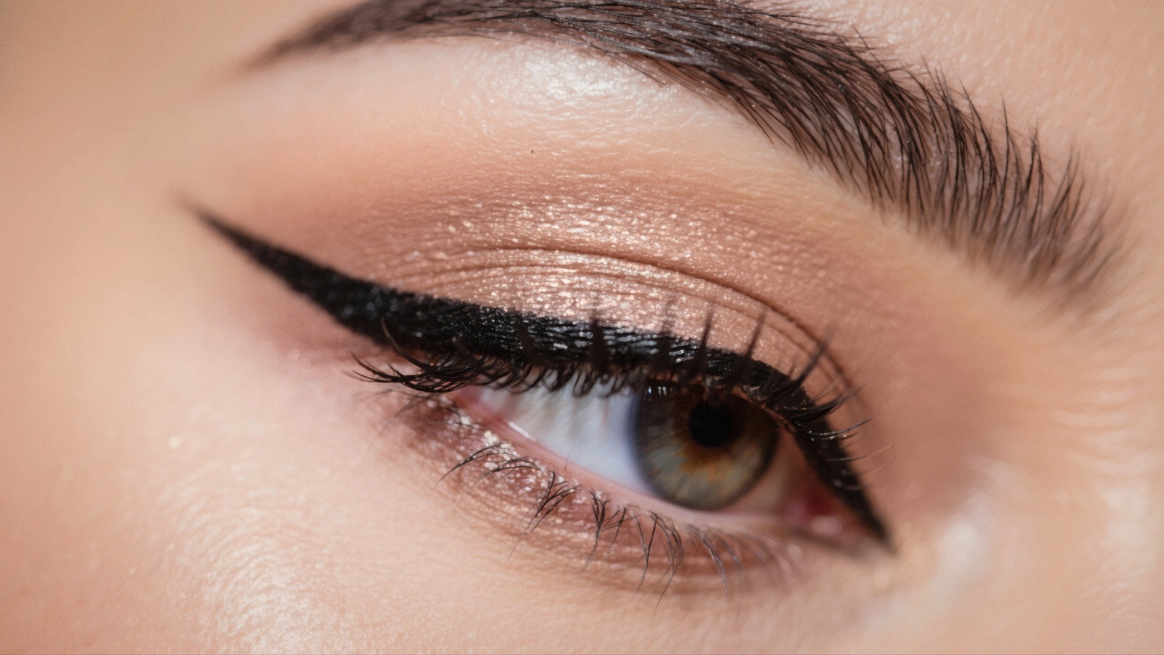 A close-up view of an eye, featuring a sharp winged eyeliner, eyeshadow and defined lashes. (Shutterstock Photo)